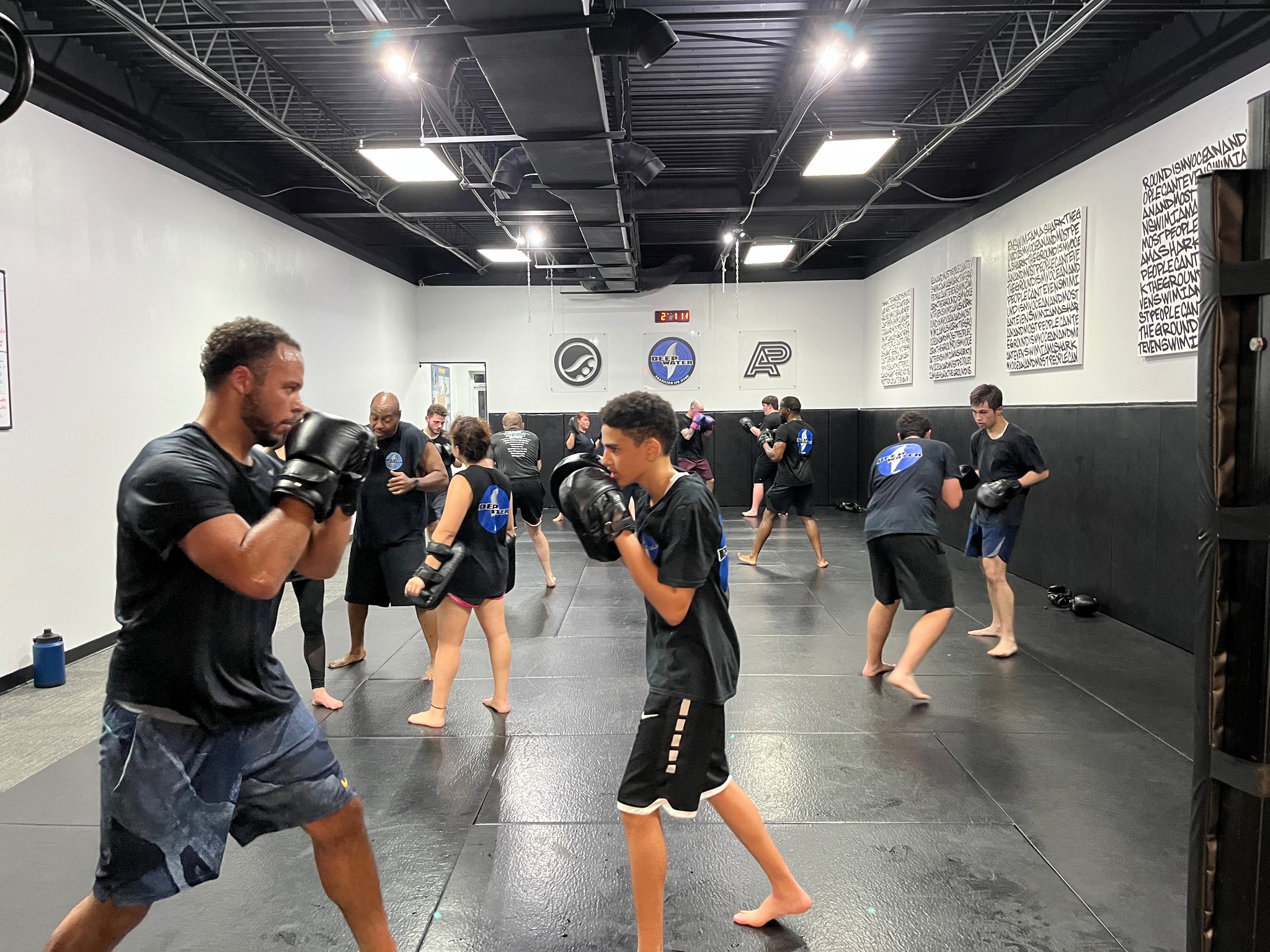 Striking Class at Deep Water BJJ in Harrisburg Adults practicing striking drills during a group class at Deep Water BJJ in Harrisburg