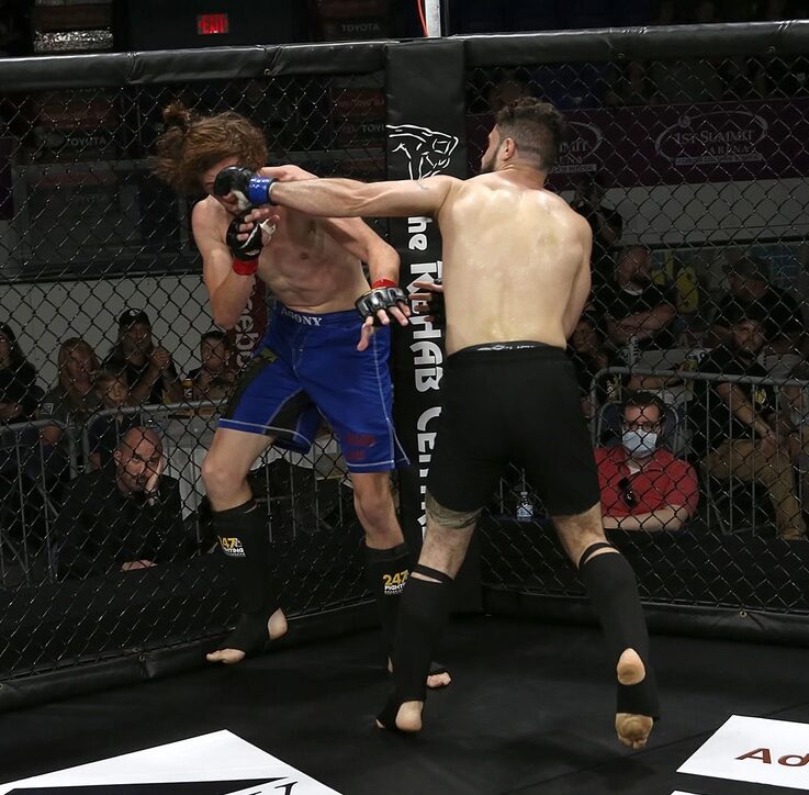 MMA Cage Striking Training in Harrisburg | Deep Water BJJ MMA athletes striking against the cage during a mixed martial arts bout.