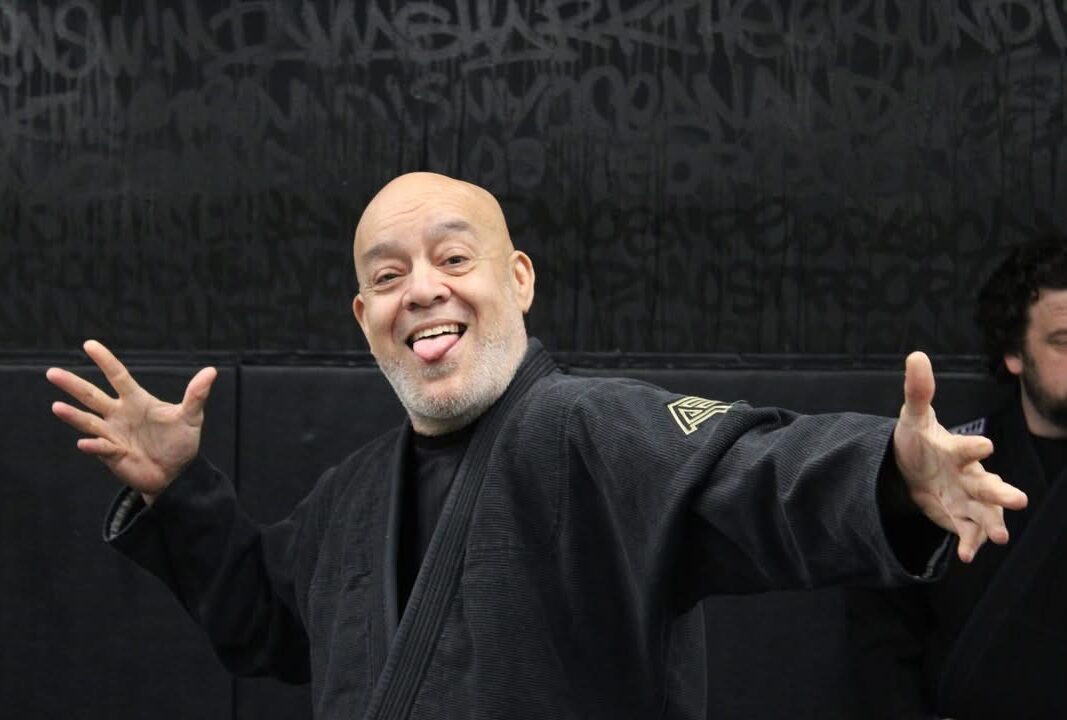 Coach Ray Ramirez Sharing a Lighthearted Moment at Deep Water BJJ Coach Ray Ramirez smiling and joking with students inside Deep Water Brazilian Jiu Jitsu in Harrisburg, Pennsylvania.